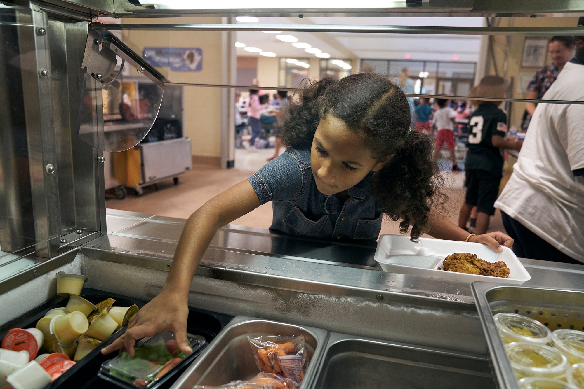 A student chooses among lunch options at East Brainerd Elementary School in Chattanooga, Tennessee.