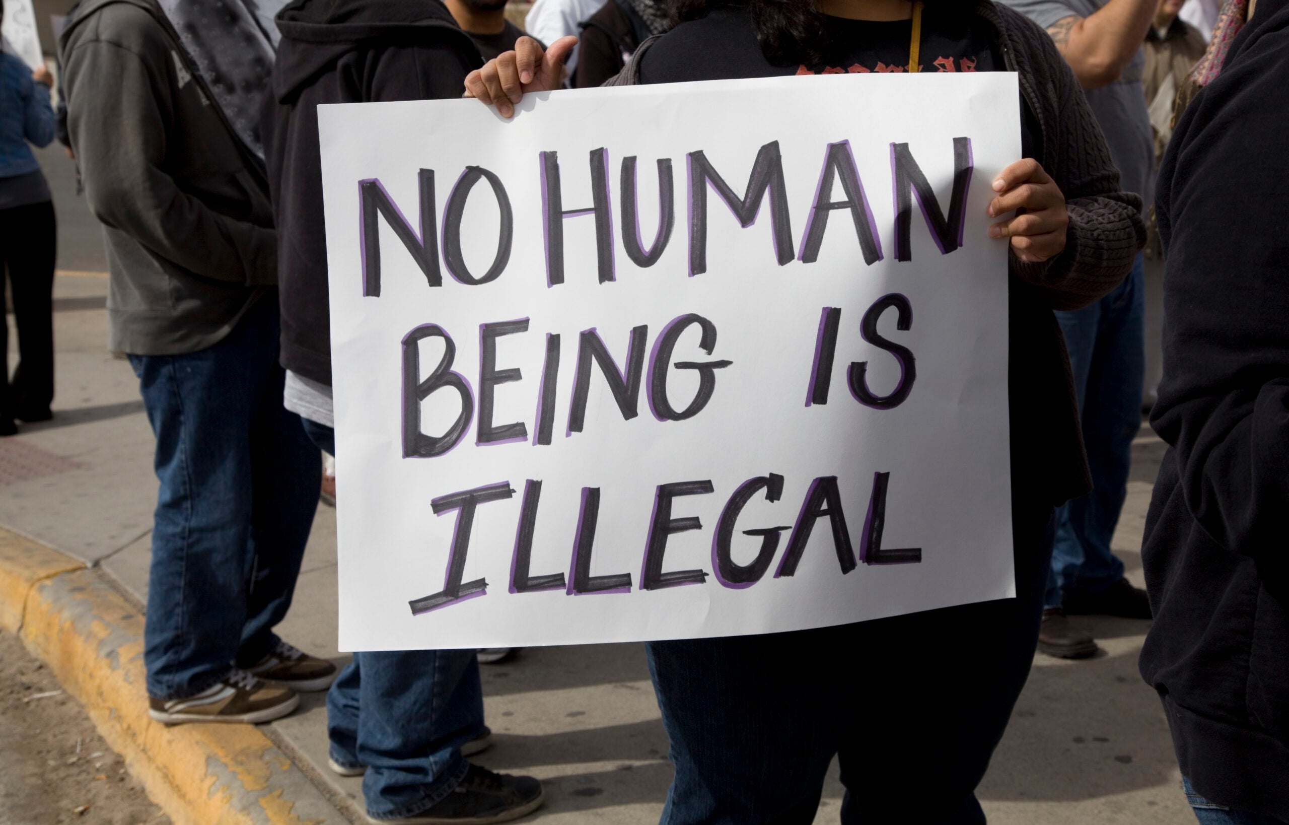 Protest sign from an Immigration Policy rally. Sign reads "No Human Being is Illegal"