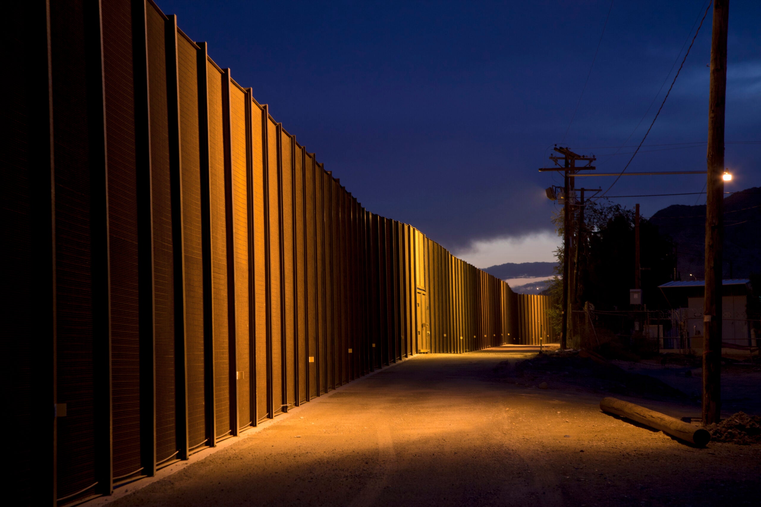 Gravel road along the Border wall between New Mexico, USA and the northern state of Chihuahua, Mexico at night.
(Getty Images)