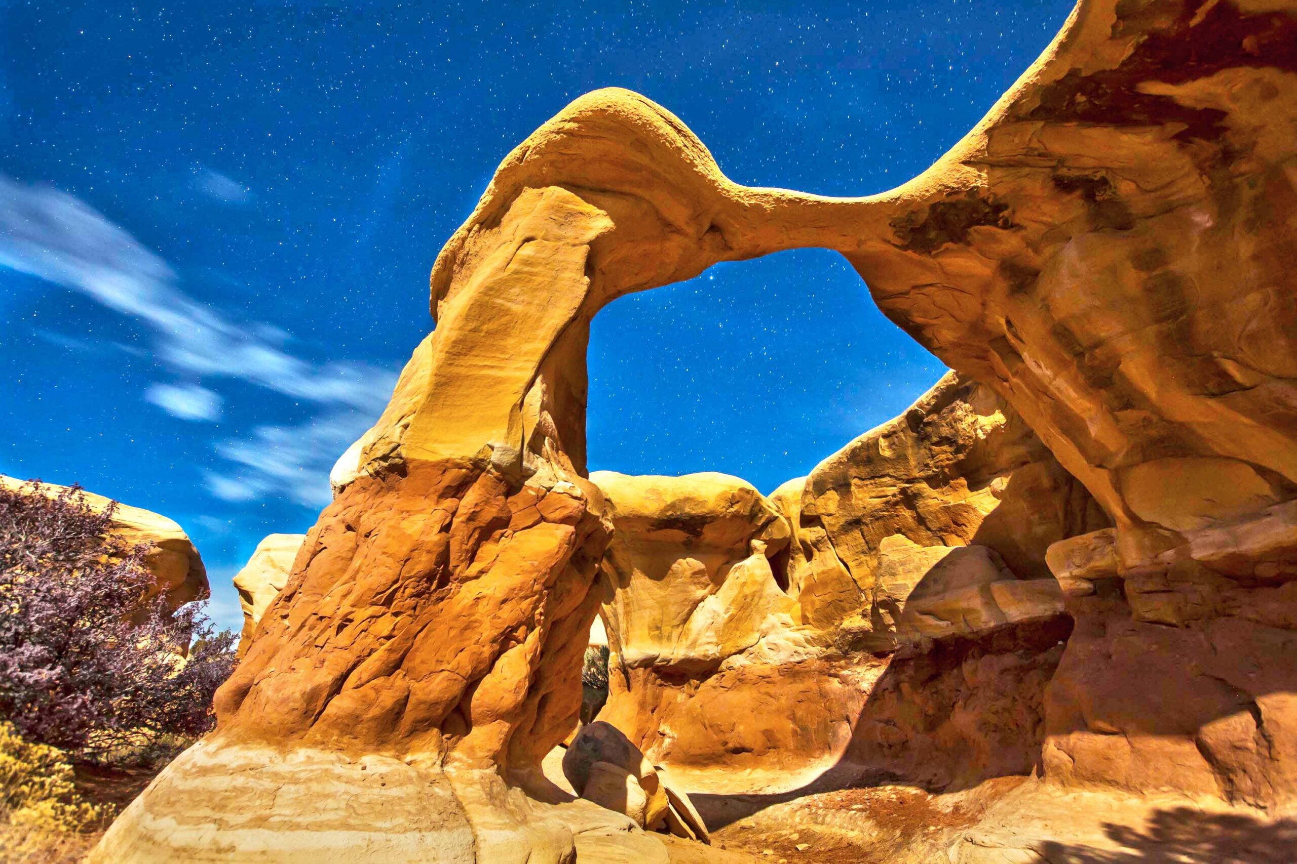 A moonlit arch rises over Grand Staircase-Escalante National Monument.