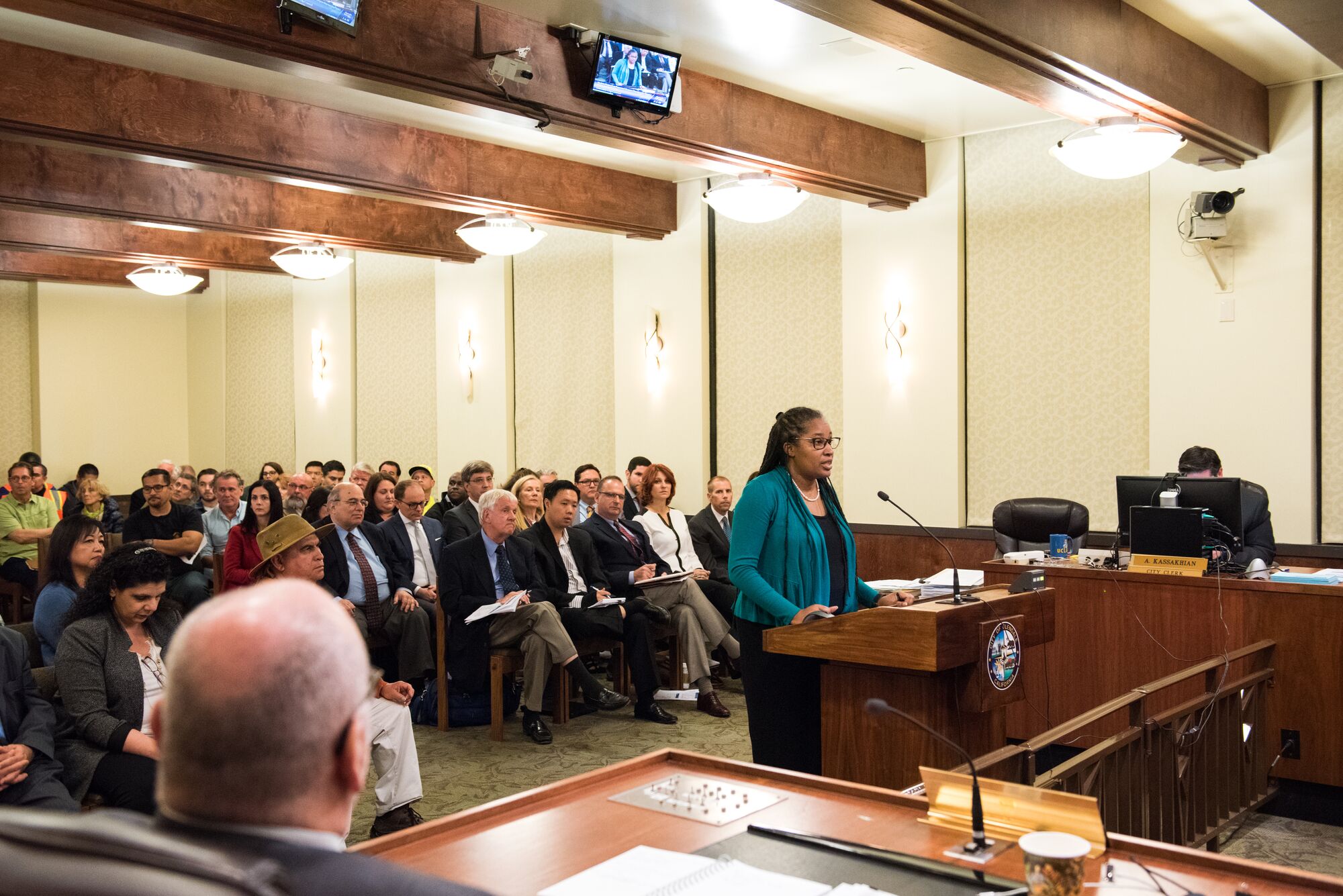 Angela Johnson Meszaros, managing attorney for the Community Partnerships Program, speaks at a community hearing in Glendale, Calif.