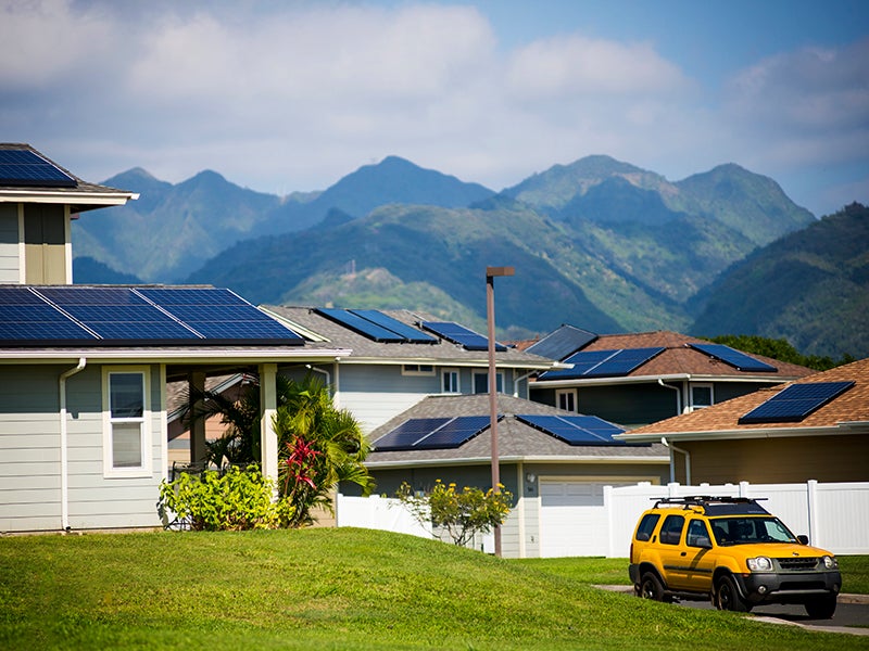 Solar panels on the rooftops of homes in the Salt Lake neighborhood of Oahu, Hawaii.