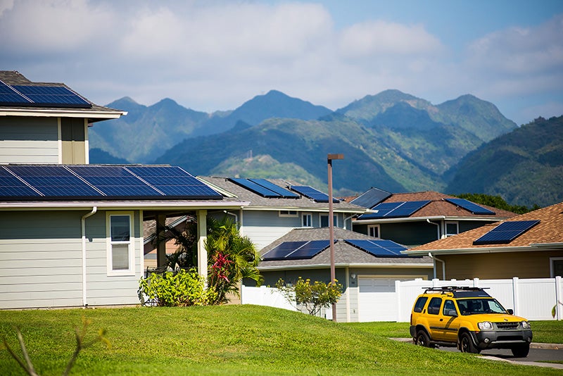 Solar panels dot the rooftops of homes in Salt Lake on Oahu, Hawaiʻi.