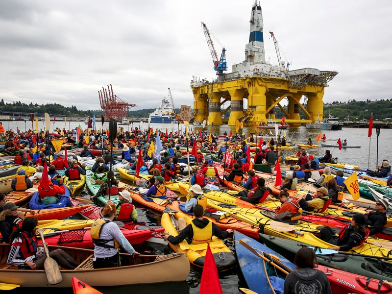 Activists who oppose Royal Dutch Shell&#039;s plans to drill for oil in the Arctic Ocean prepare their kayaks for the &quot;Paddle in Seattle&quot; protest in May 2015, in Seattle. These initial protests have sparked similar #ShellNo kayaktivism around the U.S.