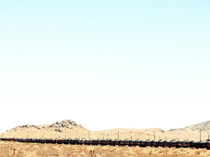 A train passes through Kern County. Two mile-long trains a day would snake along treacherous routes through the Sierra Mountains, past numerous Central Valley communities—and right past Bakersfield High School.
(Photo courtesy of Thomas Hawk)