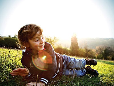 kid-sunset-grass_istock_400