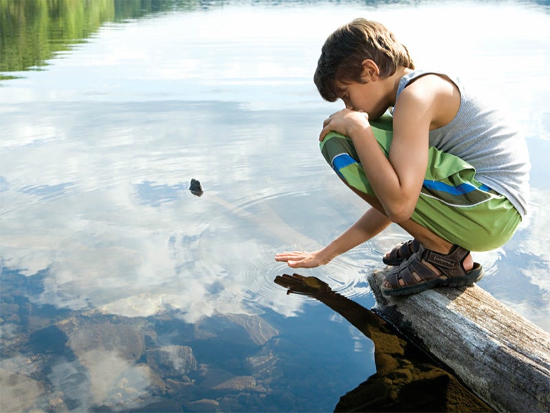 Child at a lake.