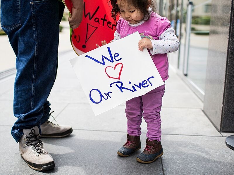 Young salmon supporter and Yurok Tribe member Tseeyaba, and her father, outside the Burton Federal Building on the day of a hearing on Klamath River flows in San Francisco, April 10, 2018.
(Martin do Nascimento / Earthjustice)