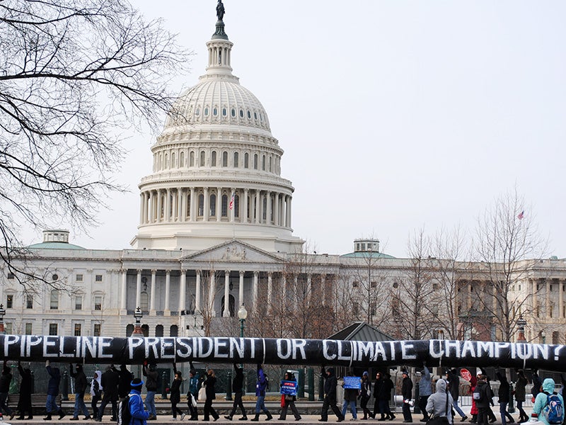 Concerned members of the public, organized by 350.org and other groups, carry a 200-yard inflatable pipeline around the Capitol Building in 2014, demanding that the President Obama reject the Keystone XL tar sands pipeline.
(Photo by Steven Tuttle via 350.org)