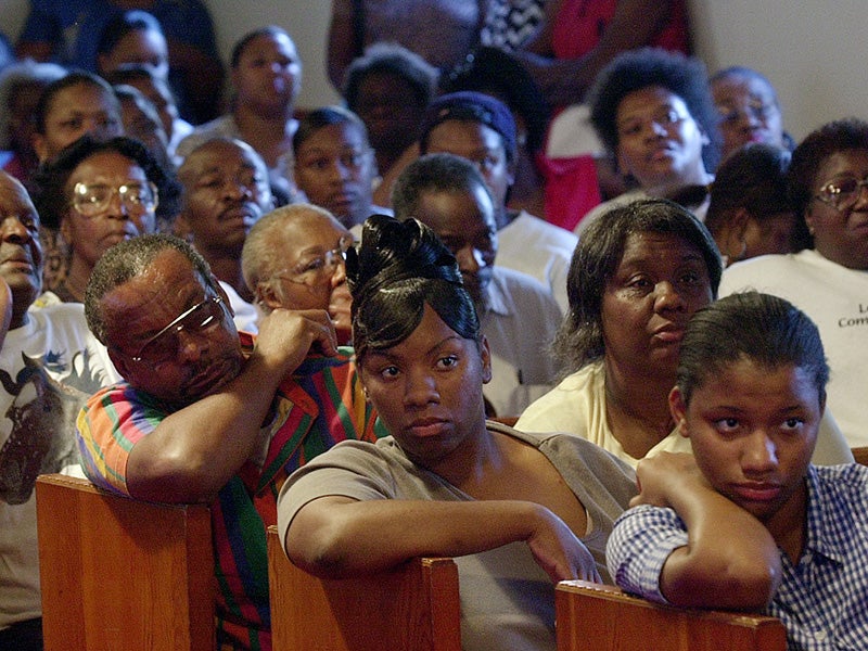 Lowndes County residents gather at the 1st Baptist Church of Hayneville, Ala. to discuss the need to install costly septic systems, or face jail time, April 30, 2002.
(Dave Martin / AP Photo)