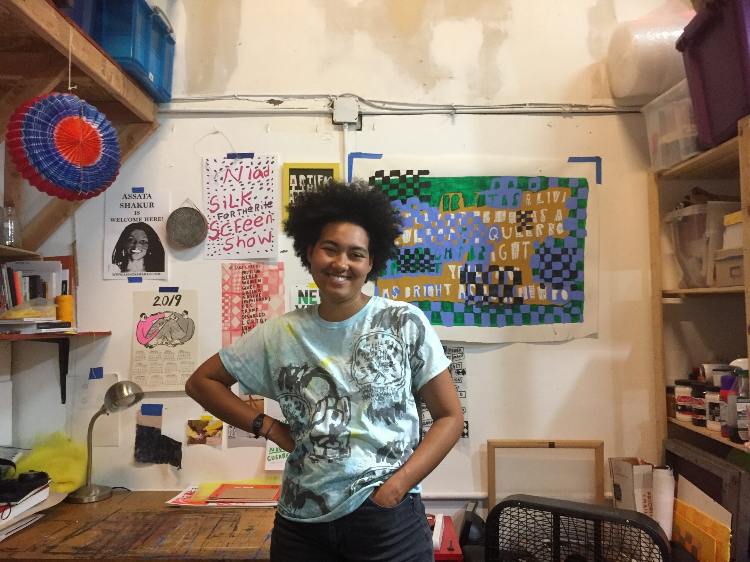 Activist and artist Lukaza Branfman-Verissimo stands in her Oakland studio.