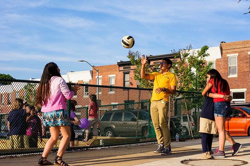 Kids play in Baltimore&#039;s Paterson Park on May 14, 2015.