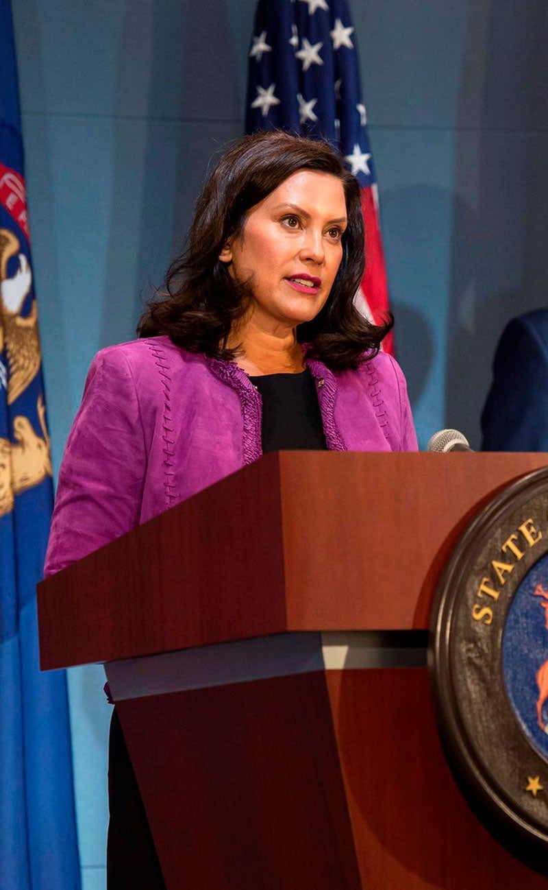 Michigan governor Gretchem Whitmer speaking in front of a podium.