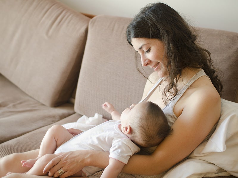 Mother and child on a sofa.