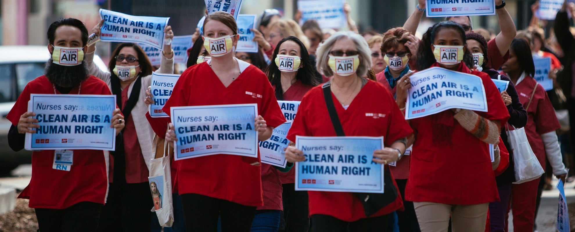 Members of the California Nurses Association march to a rally outside the EPA ozone hearing in Sacramento, CA, on February 2, 2015.
