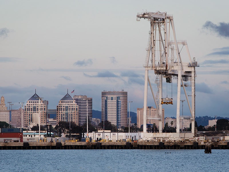 The Oakland skyline, behind the Port of Oakland. The Port is one of the largest container ship facilities on the West Coast.
(Chris Jordan-Bloch / Earthjustice)