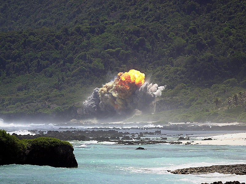 A fireball rises above the 36th Explosive Ordnance Disposal (EOD) Tarague range seconds after the detonation of an M117 bomb, as a part of the flight's training, on Andersen Air Force Base (AFB), Guam.