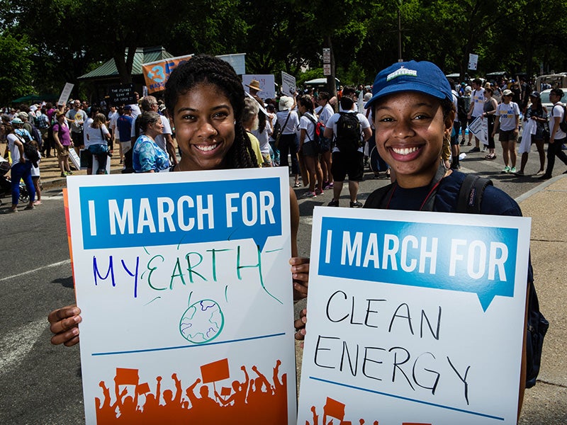Jade and Kayla, from Florida, speak out for the climate at the Peoples Climate March in 2017.