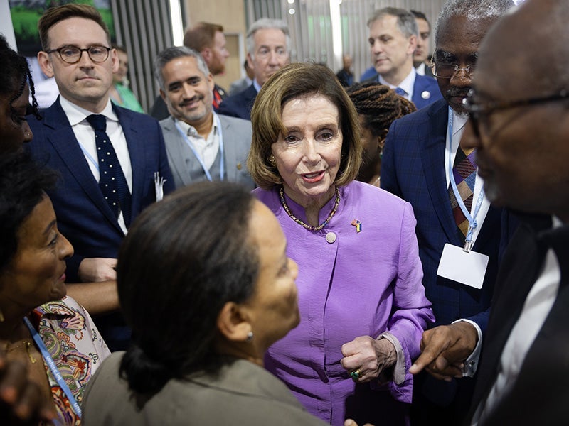 Speaker Nancy Pelosi, center, speaks with Earthjustice Board of Trustees member Ruth Santiago, foreground, and Dr. Robert Bullard, far right, at the Climate Justice Pavilion at COP27, the 2022 United Nations Climate Change Conference, in Sharm El-Sheikh,