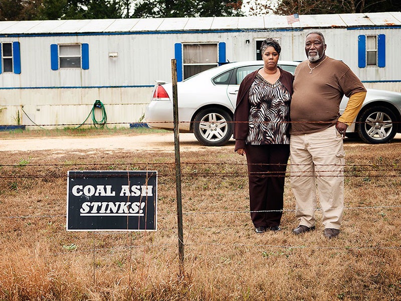 Annette Gibbs and her husband William stand in their front yard, near the Arrowhead Landfill in Perry County, AL. Four million cubic yards of toxic coal ash were scooped up from Harriman, TN, the site of the nation's worst toxic spill, and dumped at the landfill.
(Chris Jordan-Bloch / Earthjustice)