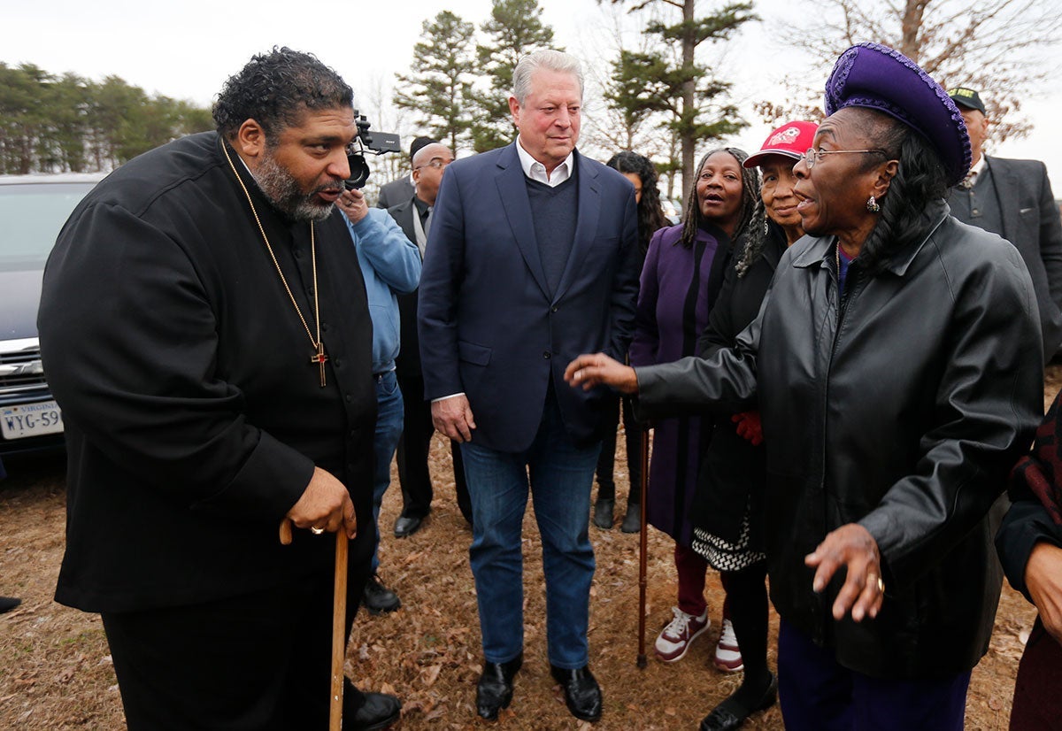 Rev. William Barber, left, and former Vice President Al Gore, center, speak with local resident Ella Rose in front of her home in Union Hill, Va., Feb. 19, 2019. Mrs. Rose's home was adjacent to a proposed compressor station site for the Atlantic Coast Pipeline.