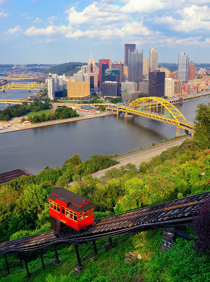 Incline operating in front of the downtown skyline of Pittsburgh, Pennsylvania, USA.