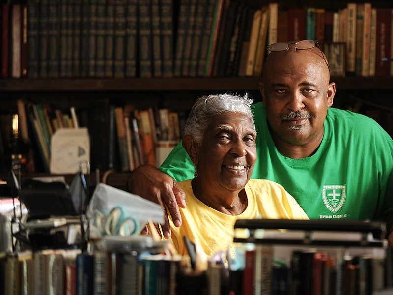 Pastor Ron Smith with his mother Ann Smith, retired teacher and community leader, in Ann's office at her home near Tallassee, AL.
(Jeronimo Nisa for Earthjustice)