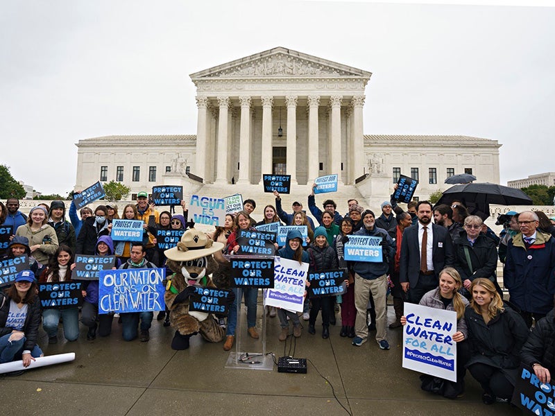 People braved the cold and rain for a "Protect Our Waters" rally at the U.S. Supreme Court in Washington, D.C., on Oct. 3, 2022, as oral arguments were heard in Sackett v. EPA. The rally called on the Justices to safeguard our nation’s waterways.
(Melissa Lyttle for Earthjustice)
