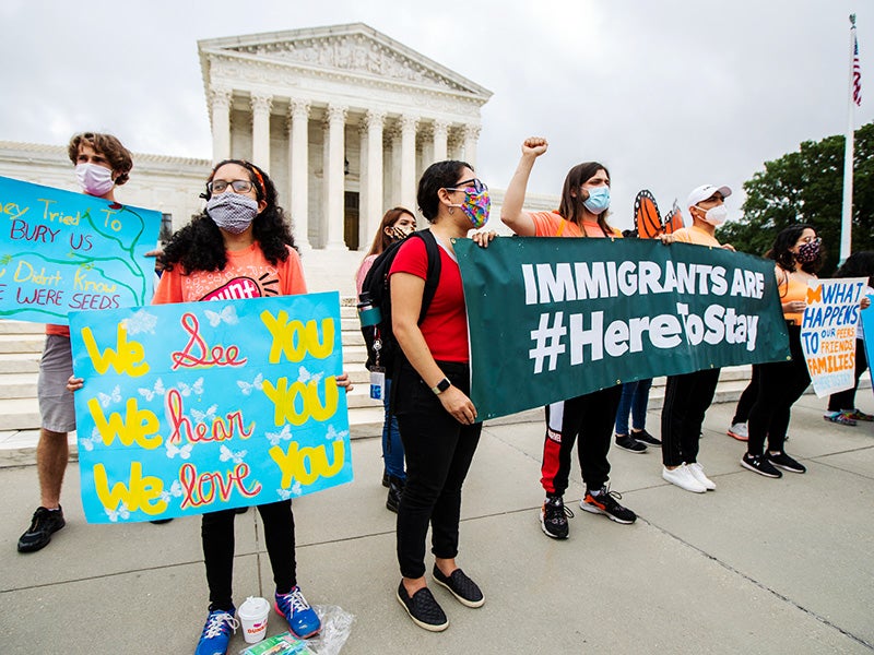 Deferred Action for Childhood Arrivals (DACA) students celebrate in front of the U.S. Supreme Court after the high court rejects the administration&#039;s bid to end legal protections for young immigrants, Jun. 18, 2020.