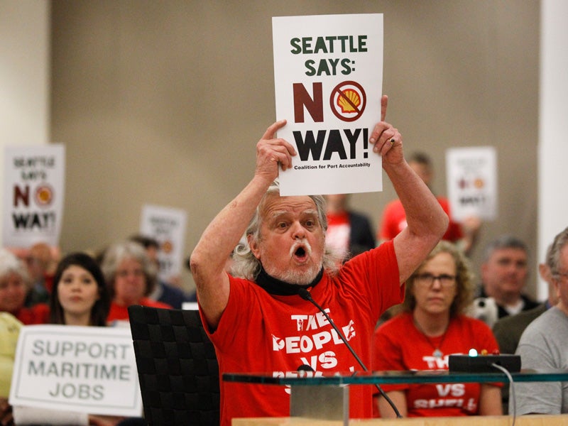 Jack Smith compels the Port of Seattle commissioners on March 24 to reverse their lease agreement with Foss Maritime.
(Joe Nicholson for Earthjustice)