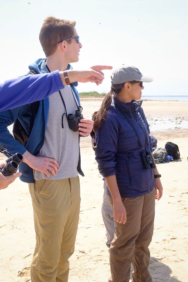 Sharmeen Morrison (right), senior associate attorney with Earthjustice's Biodiversity Defense Program, observes red knot shorebirds coming through the Delaware Bay near Fortescue, N.J.