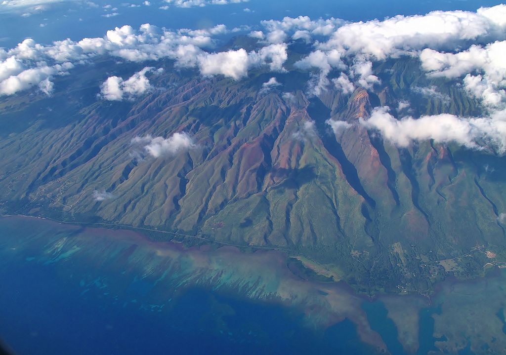 The South Shore of Moloka&#039;i, with Kawela Valley on the left.  Moloka‘i Ranch covers 55,575 acres, roughly one-third of the island. The Ranch’s plantation-era stream diversions in Central Moloka’i take water from native streams to the island’s dry west end