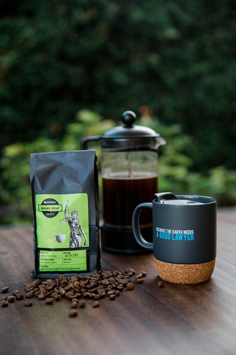 The perfect mug for making a statement. Featuring Earthjustice's famous tagline on a matte grey ceramic mug with a built-in cork coaster and splash proof removable lid.