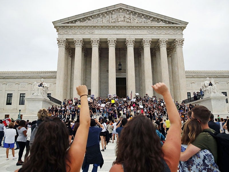 Protesters gather outside of the Supreme Court.
(Alex Brandon / AP)