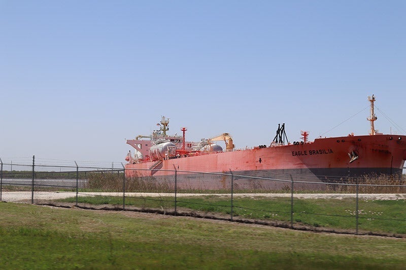 Oil tanker loading at onshore terminal in the Gulf of Mexico in Port Arthur, Texas.
