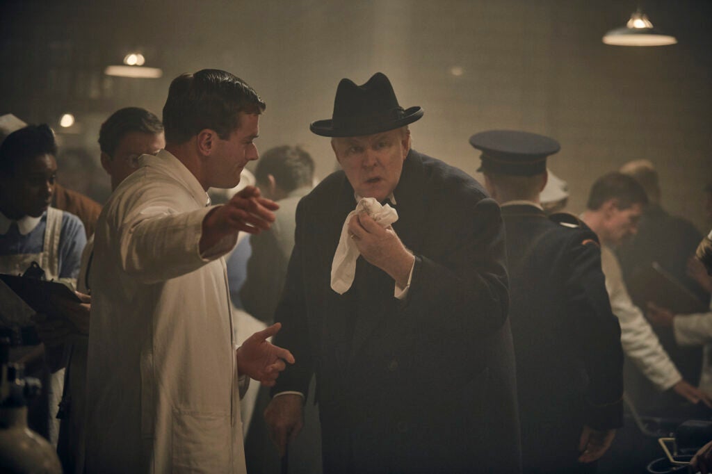 John Lithgow, center, plays Winston Churchill in the series "The Crown."
(Image Courtesy of Netflix)