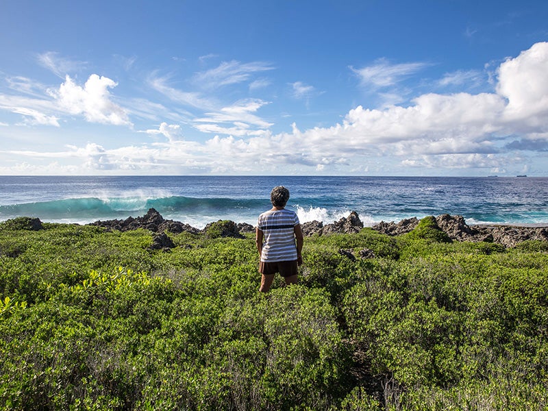 Deborah Fleming, a member of the Tinian Women Association, looks out onto the Pacific Ocean from the island of Tinian.