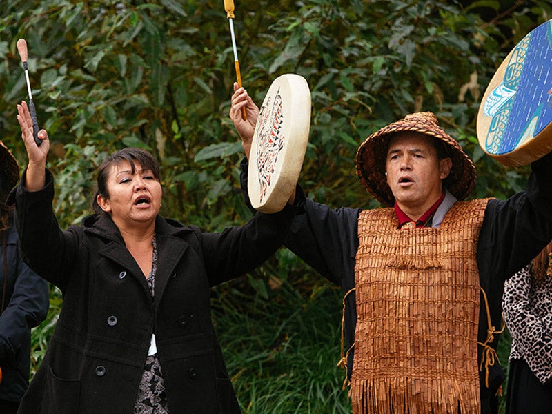 First Nations Swinomish members participate in a traditional ceremony before oral testimonies on the Kinder Morgan TransMountain Pipeline begin.