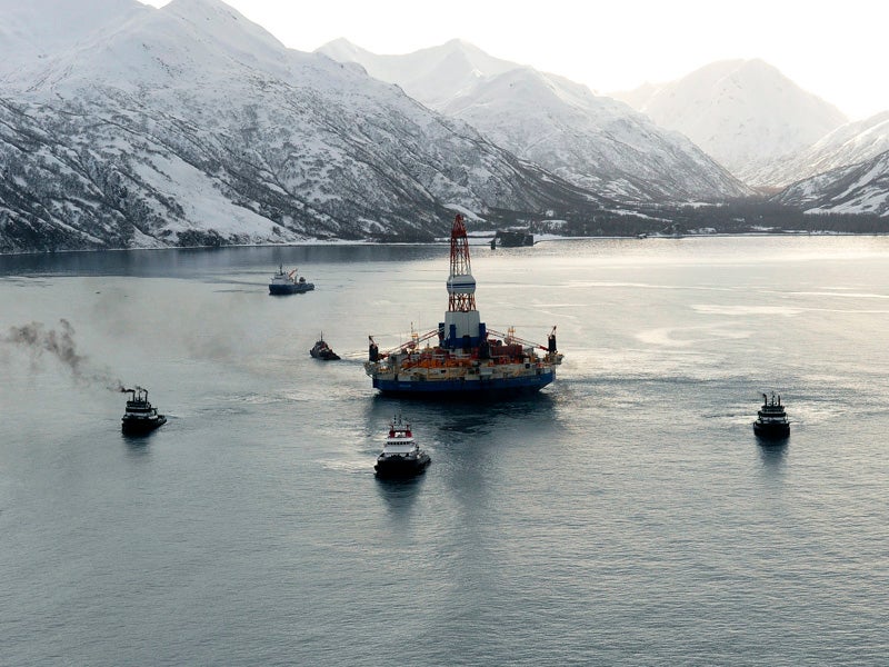 Department of Defense tug boats pull Shell&#039;s stranded Kulluk oil rig off of the Alaska coast.