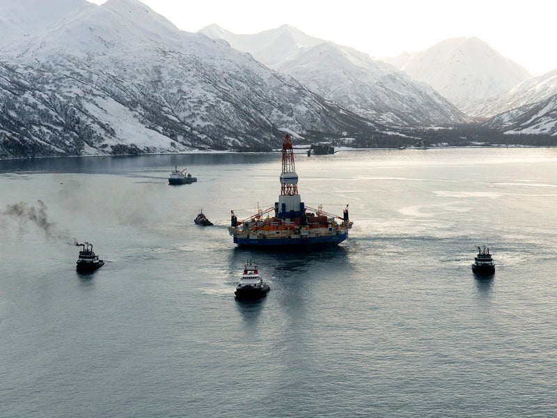 Department of Defense tug boats pull Shell's stranded Kulluk oil rig off of the Alaska coast.