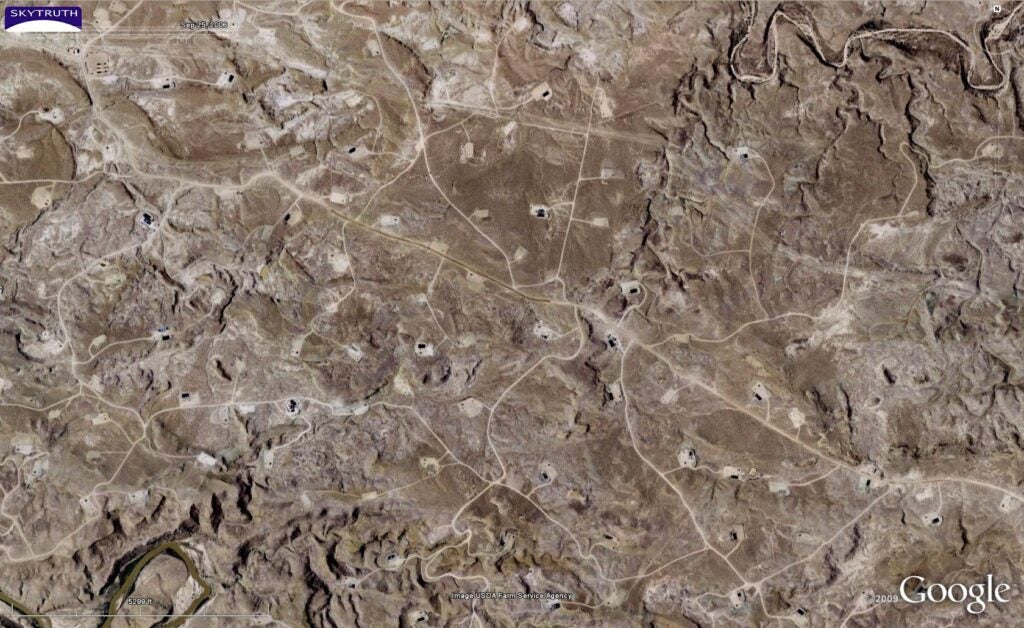 Drilling in the Uinta Basin near the town of Ouray. Drilling locations appear as bright spots and are connected by a network of roads and pipeline corridors.
(Photo courtesy of Skytruth)