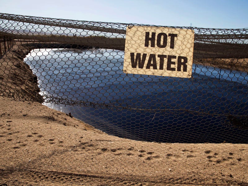 An unlined waste pit with fracking fluid and other drilling wastewater in California's Central Valley.