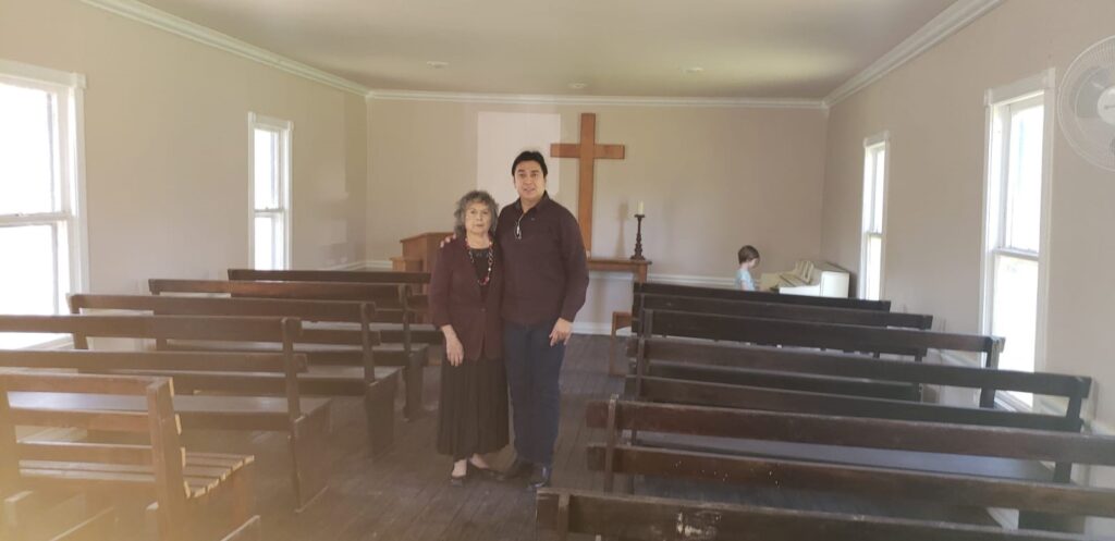 Descendants of Eli Jackson stand in a 145-year-old Texan church that bears his name. Construction on Trump's border wall may desecrate a cemetery next to the church.
(Image Courtesy of Sylvia Ramirez)