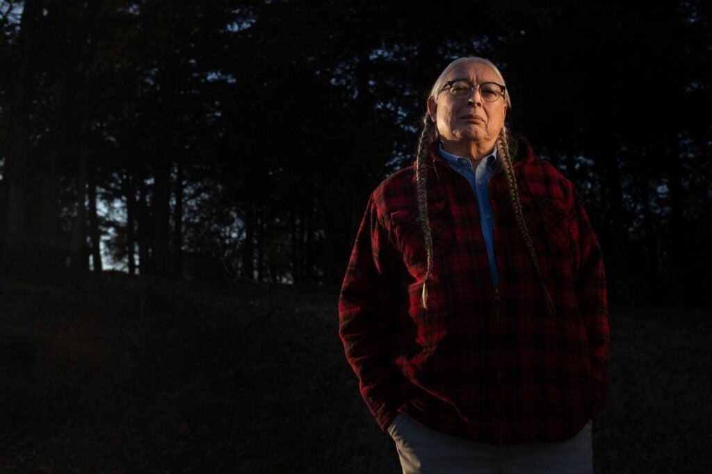 Walter Echo-Hawk, a highly regarded Native Rights lawyer and Pawnee Tribal member, stands on his land.