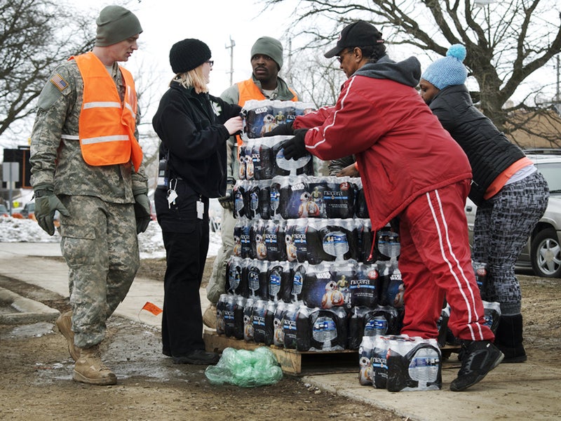 Residents of Flint at a bottled water distribution location in downtown Flint, Michigan on January 23, 2016.