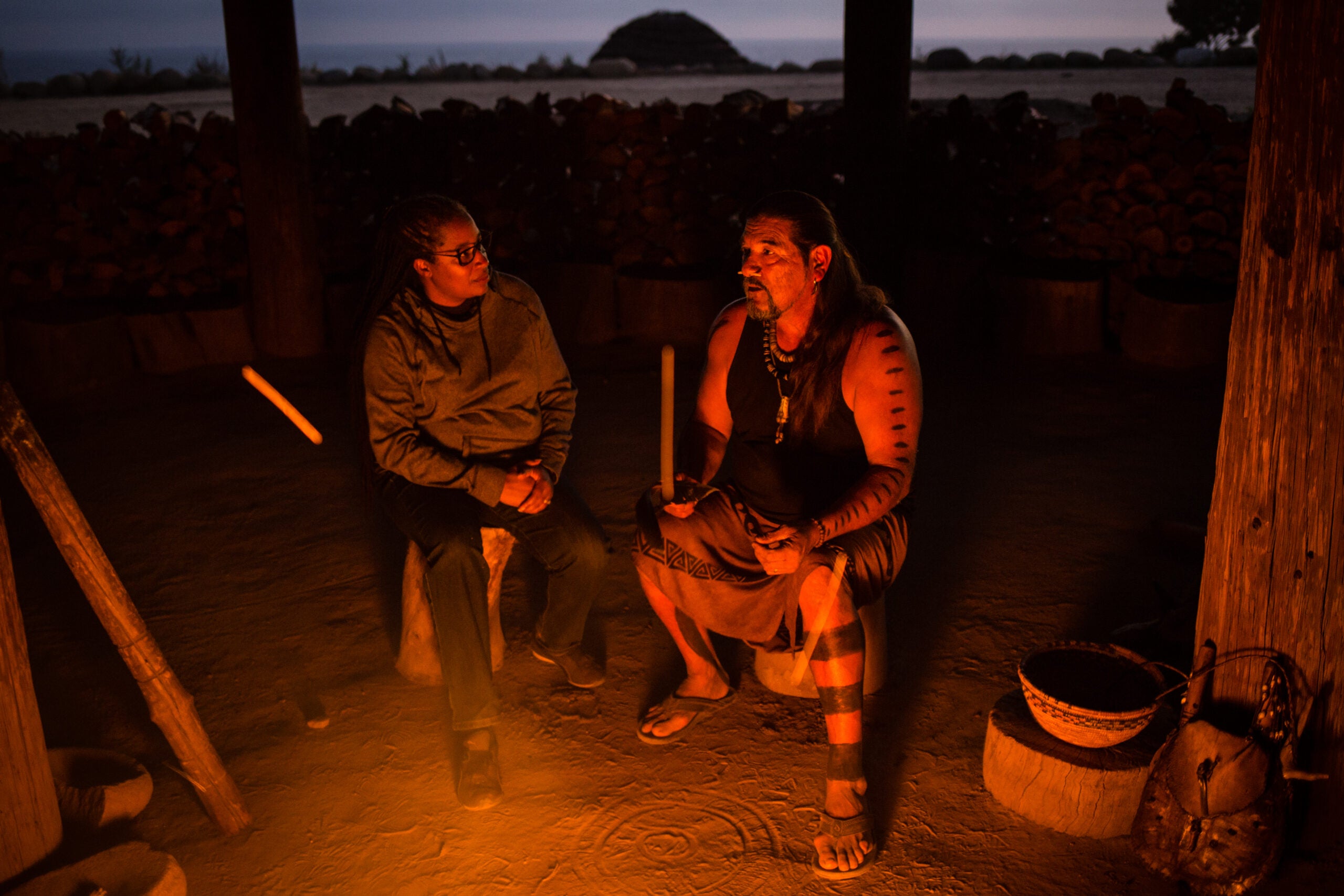 Angela Johnson Meszaros sits with Mati Waiya at Wishtoyo Village.